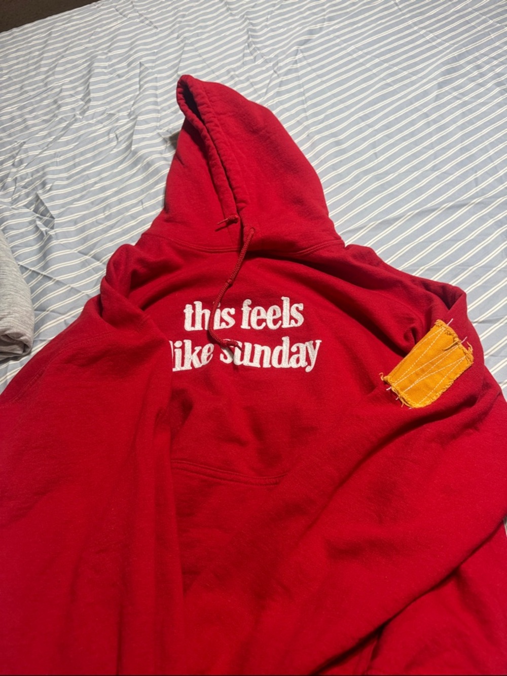 Red Hoodie with "this feels like sunday" Text